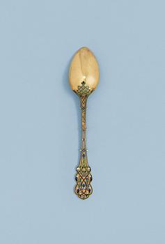 1193. A RUSSIAN SILVER-GILT AND ENAMEL TEA-SPOON, un identified makers mark, Moscow 1880's.