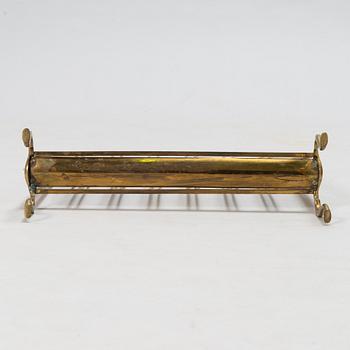 A folding brass magazine stand, first half of the 20th century.