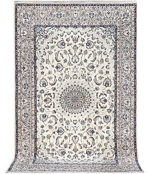 A Nain carpet, part silk, c. 294 x 193 cm.
