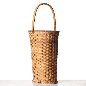 Firma Svenskt Tenn, a fretted rattan umbrella stand, mid 1900's, provenance Estrid Ericson.