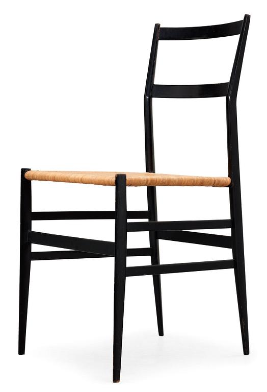A Gio Ponti 'Superleggera' chair, Cassina, Italy, black painted ash with ratten seat.