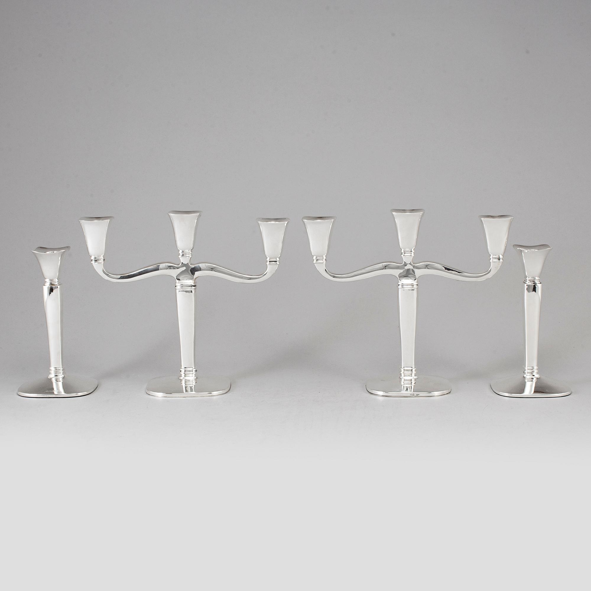 Four (2+2) silver candle holders and candelabras, Germany, 20th century.