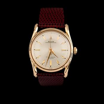 ARMBANDSUR, 18 k guld, Rolex Oyster Perpetual, Bombay 6590, 1900-talets mitt.