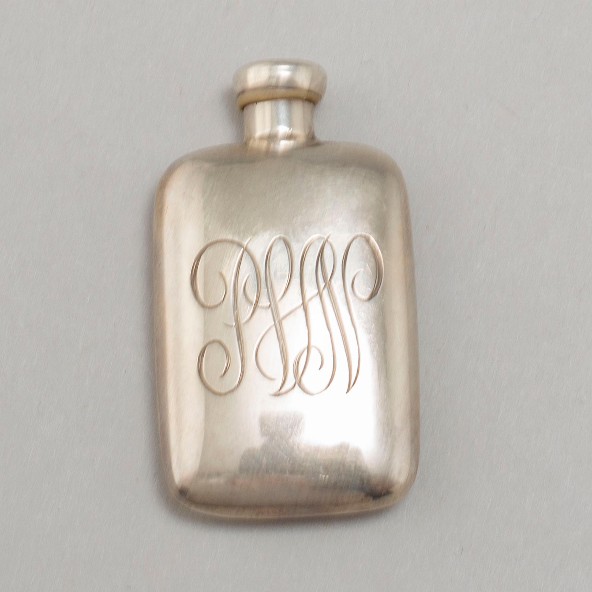 A TIFFANY & CO PERFUME BOTTLE, silver.
