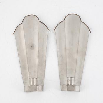 Nils Fougstedt, a pair of pewter and brass wall sconces, model "A 146", Svenskt Tenn, Stockholm 1927.