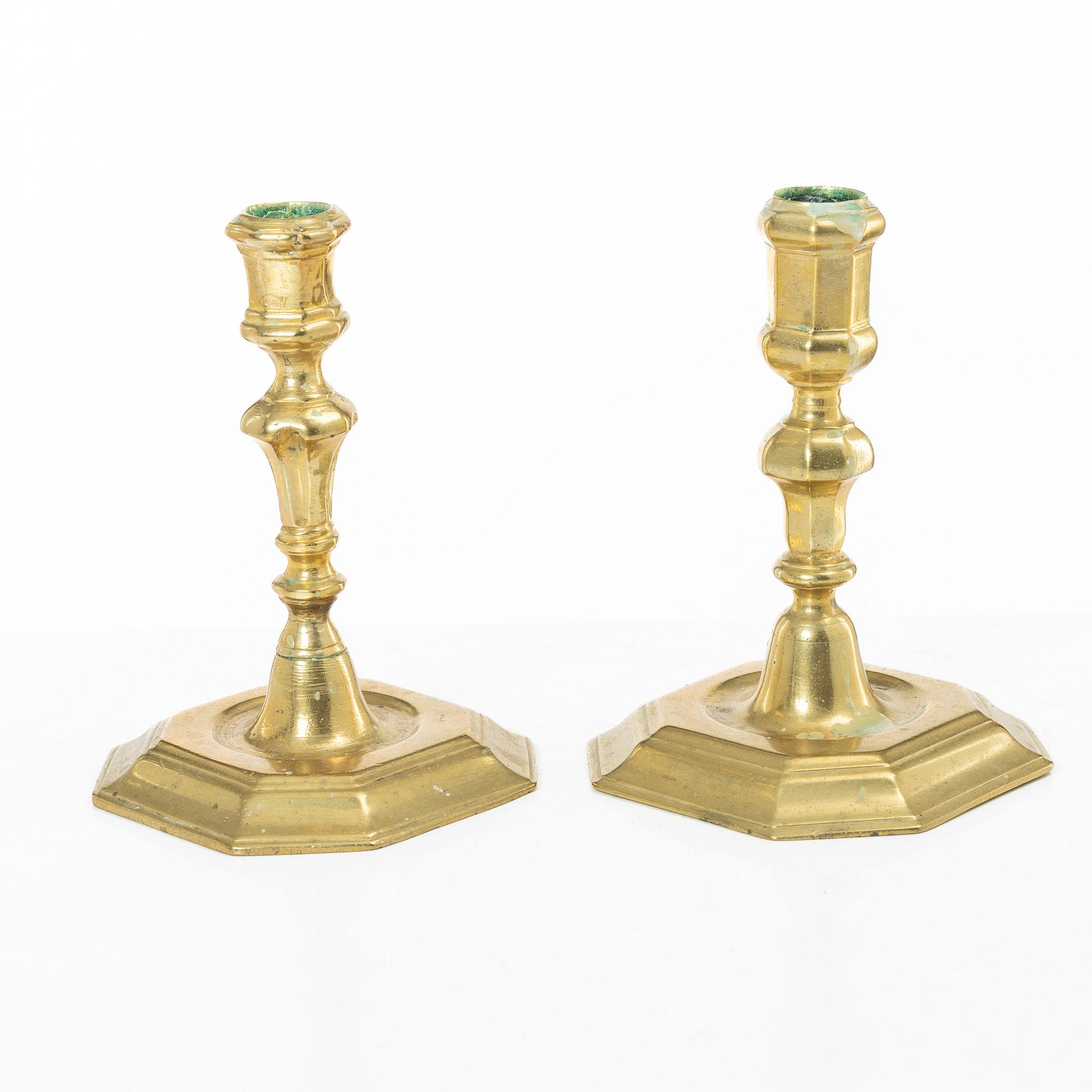 A set of two Northern European late baroque brass candlesticks, first part 18th century.