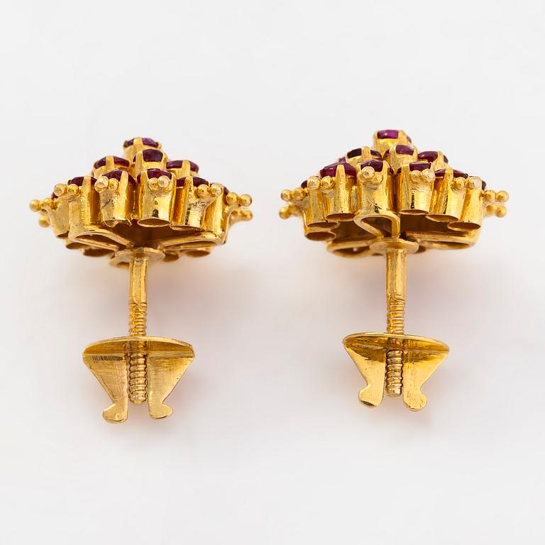 A pair of 18K gold earrings and rubies.