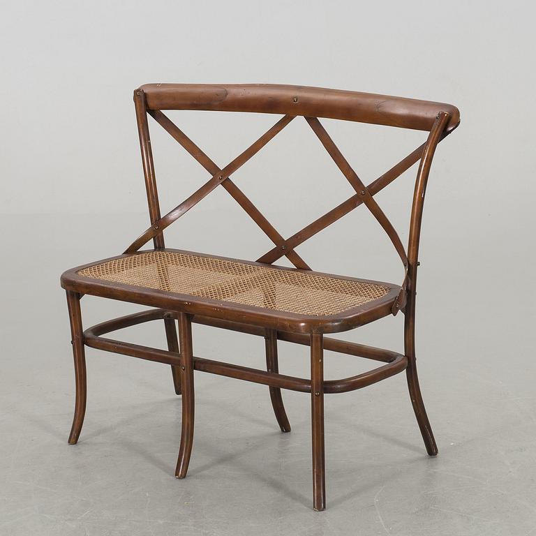 A wooden sofa, a table and four chairs, later part of the 20th century.