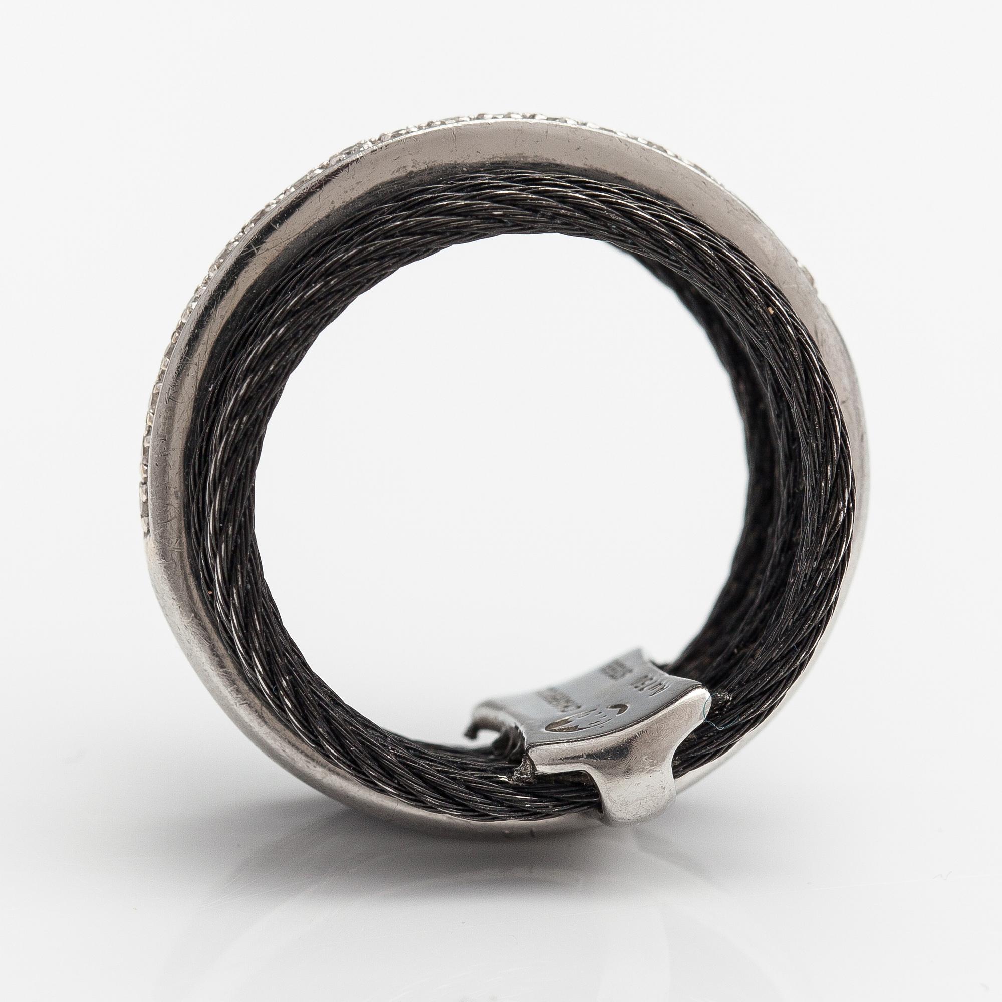An 18K white gold and steel ring with diamonds ca. 0.095 ct in total. Charriol.
