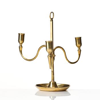 A Gustavian brass three light candelstick.