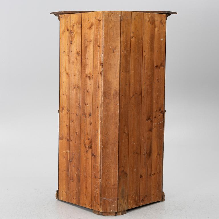 A corner cupboard, dated 1779.