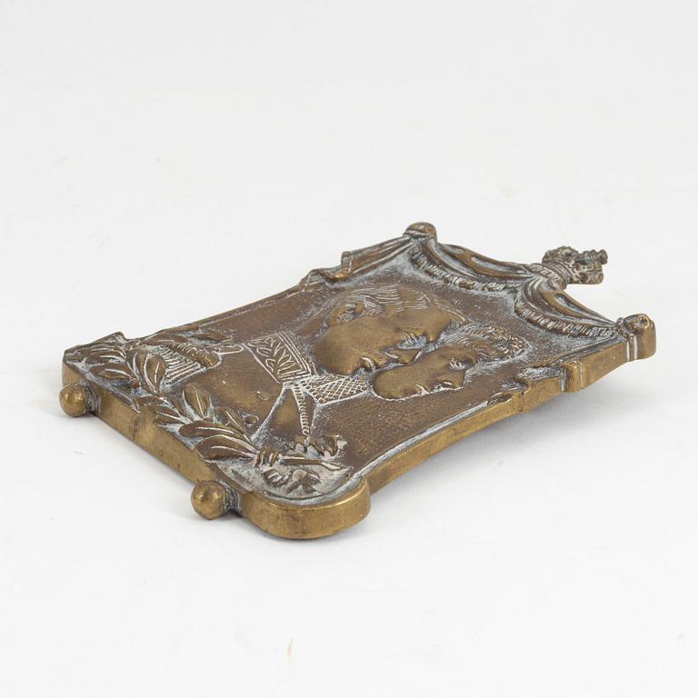 A 19th century bronze plaque.