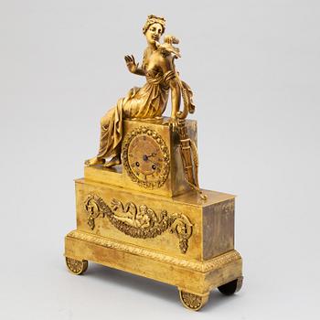 An empire bronze mantle clock, first half of the 19th century.