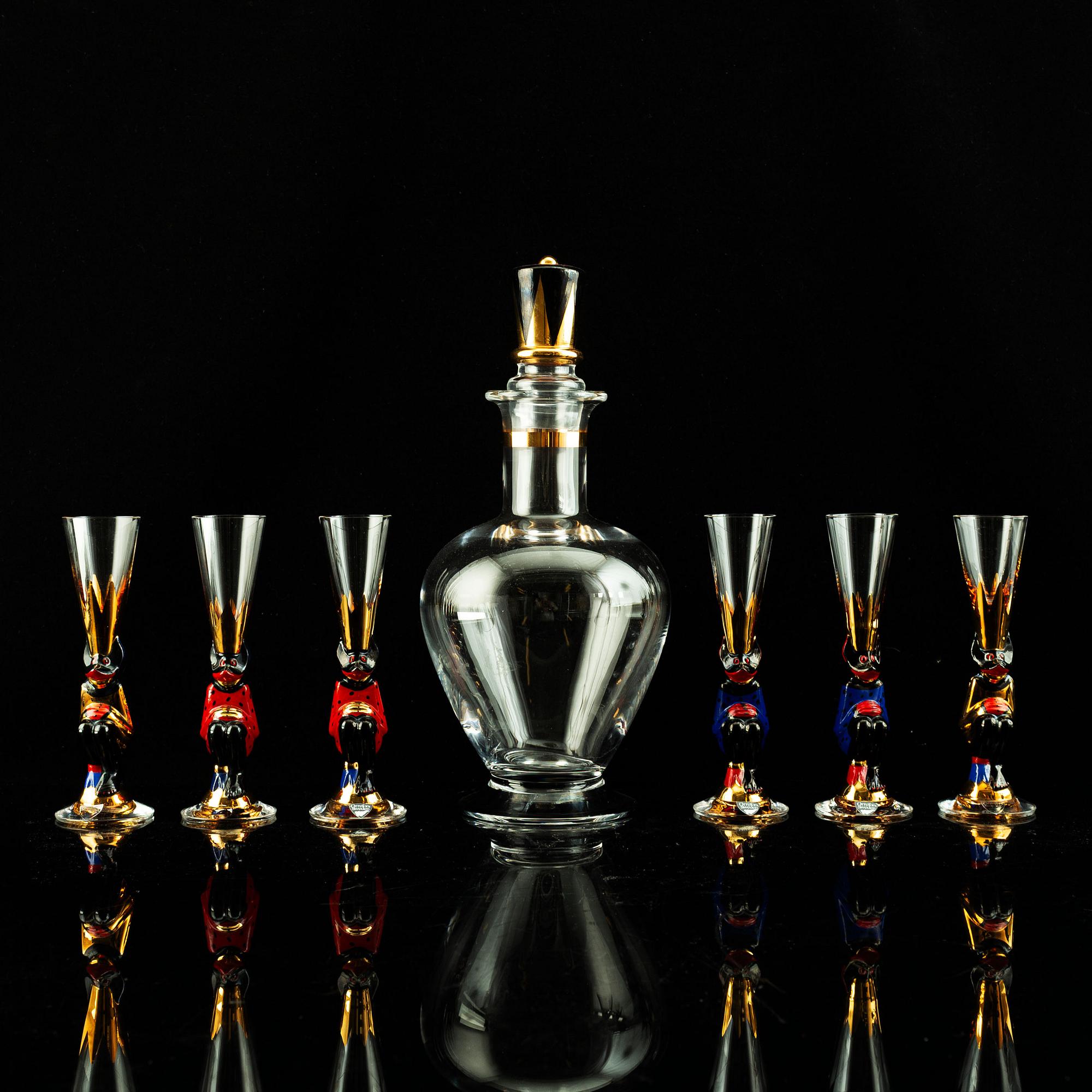 Gunnar Cyrén, a set of six "Devil" shot glasses and a decanter from the "Nobel" series, Orrefors Sweden post 1996.