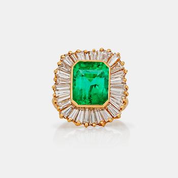 747. A circa 6.00ct step-cut emerald and tapered baguette-cut diamonds. Total carat weight of diamonds circa 3.00 cts.