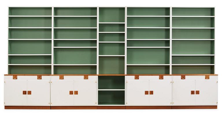 A Josef Frank set of five walnut and white lacquered bookshelves, Svenskt Tenn, model 2255.