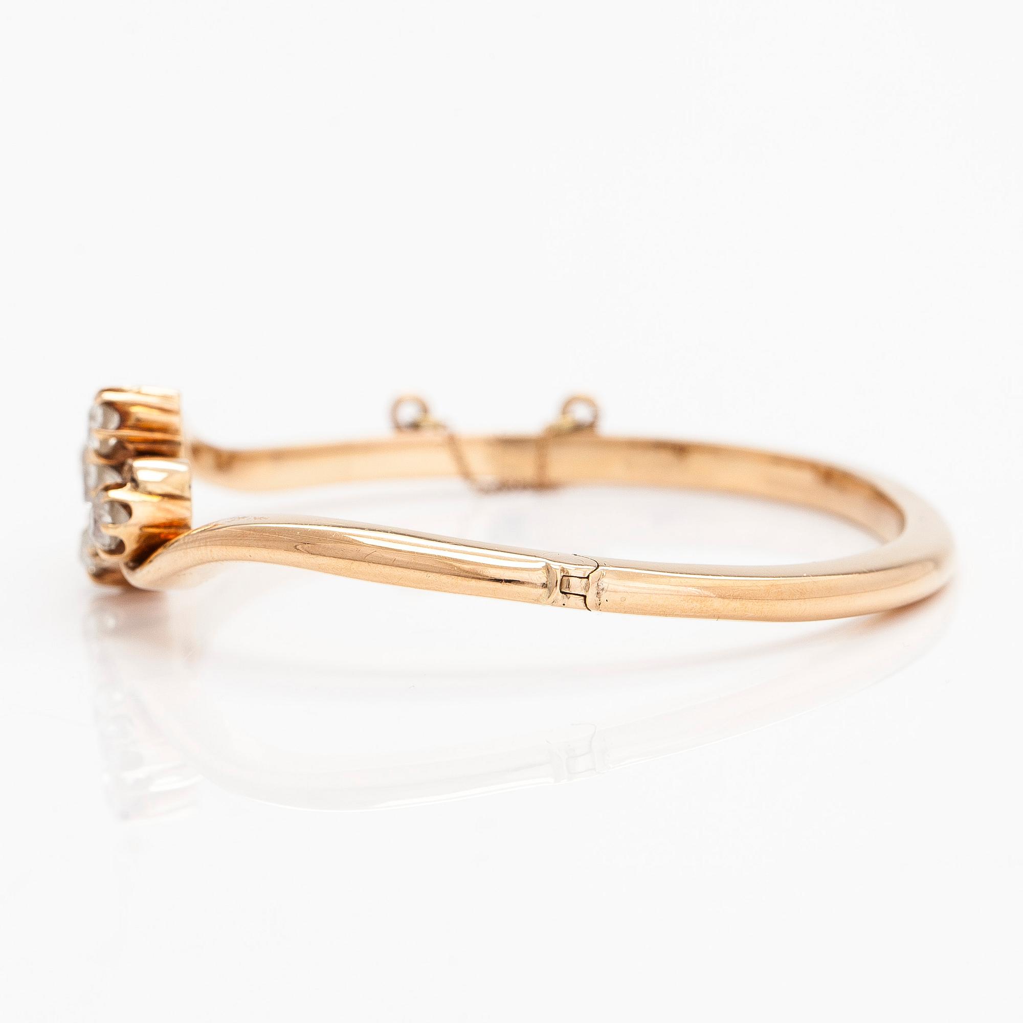 A 14K gold bangle, set with old-cut diamonds, St. Petersburg 1882-1898.