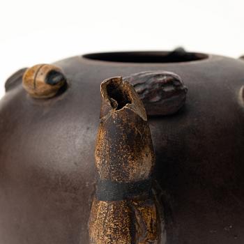 A Chinese 'hundred-fruit' yixing teapot, Qing dynasty (1644-1912).