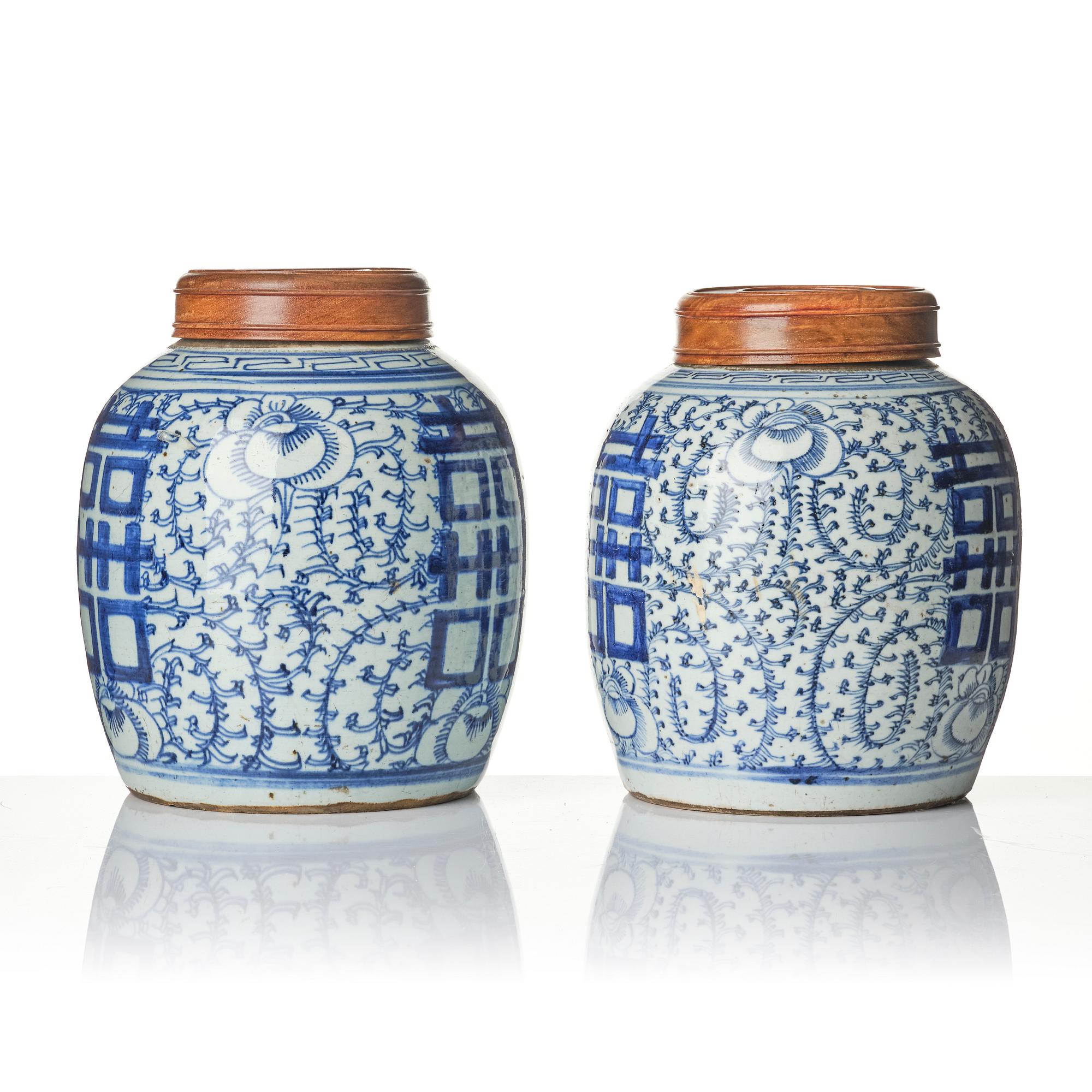 A pair of blue and white porcelain pots with covers, China, 19th century.