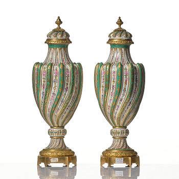 A pair of French 'Sèvres' porcelain urns, 1890s.