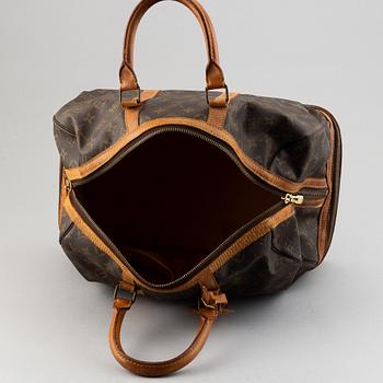 Louis Vuitton, a monogram canvas weekend bag.