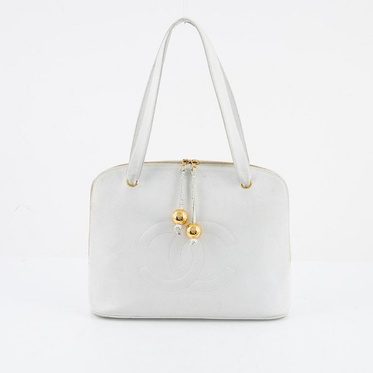 Chanel, a white caviar vintage bag.