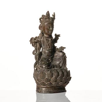 A bronze figure of Guanyin, late Ming dynasty (1368-1644).