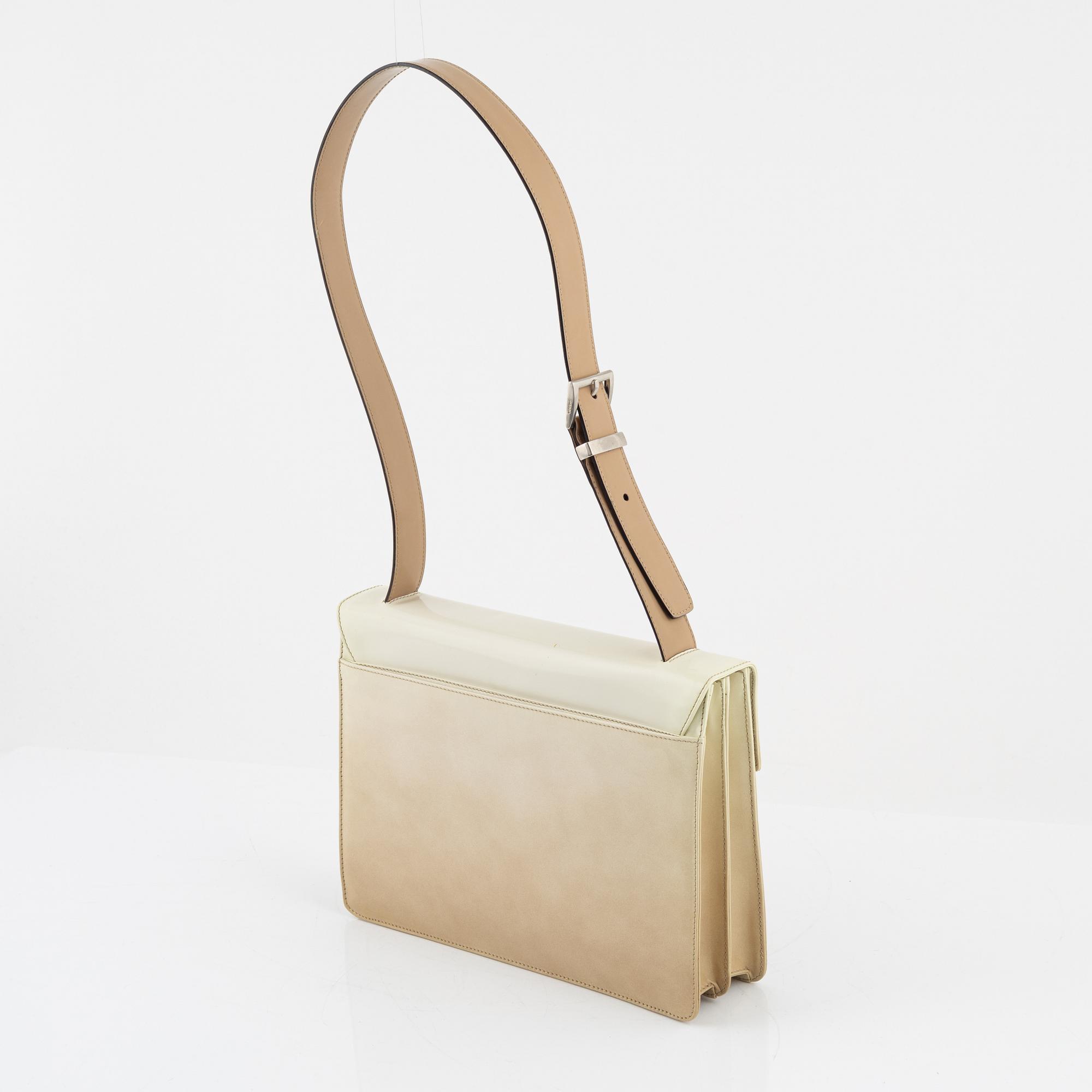 Prada, a beige patent leather bag.