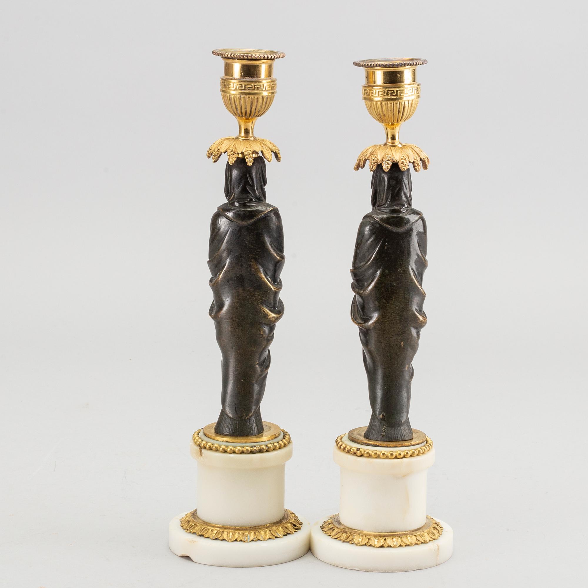 A pair of Louis XVI 18/19 century candlesticks.