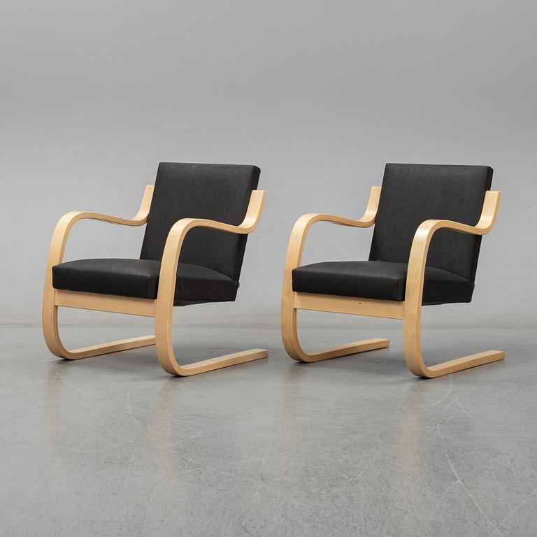 Alvar Aalto, a pair of model 406  birch armchairs, Artek, Finland, 2002.
