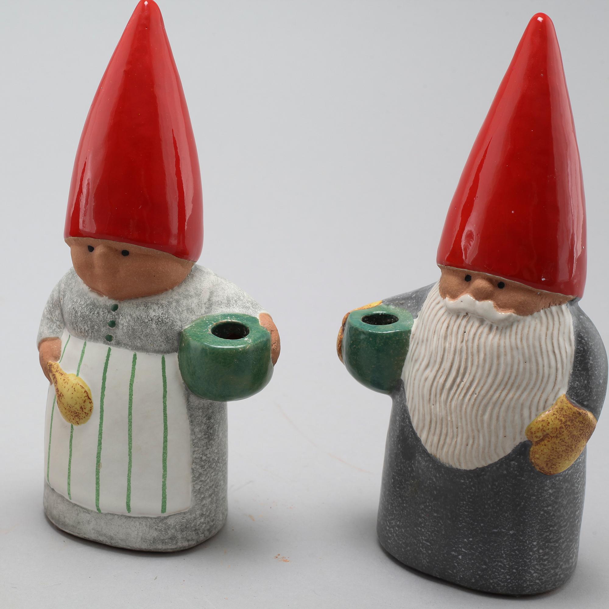 Three ceramic candlesticks by Lisa Larson for Gustavsberg, partly signed.