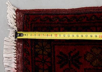 An Afghan runner, ca. 295 x 82 cm.