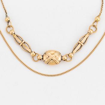 Two gold necklaces.