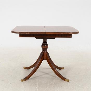 A mid 1900s English style mahogany dining table.