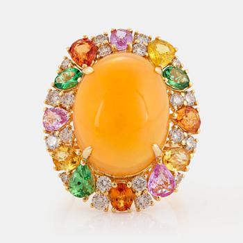 An 18K gold ring set with an opal, round brilliant-cut diamonds.