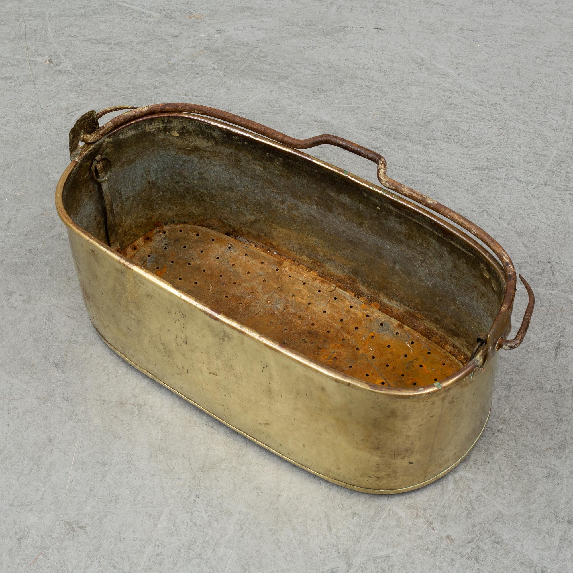 A 19th century brass fish pan.
