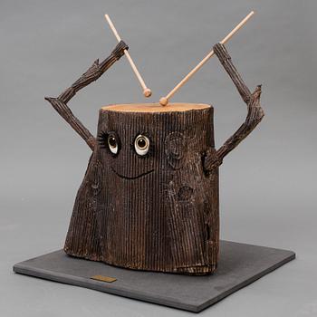 A drumming tree stump made by JoAnn Tan Studio for NK 2016.