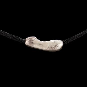 A silver and gold pendant by Minas Spiridis for Georg Jensen, designed in the 1990's.