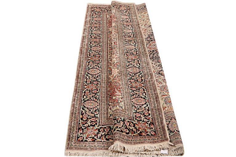 A carpet, silk Kashmir, c. 279 x 180 cm.