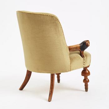 Swedish designer, a stained and carved birch folkart chair, ca 1900.