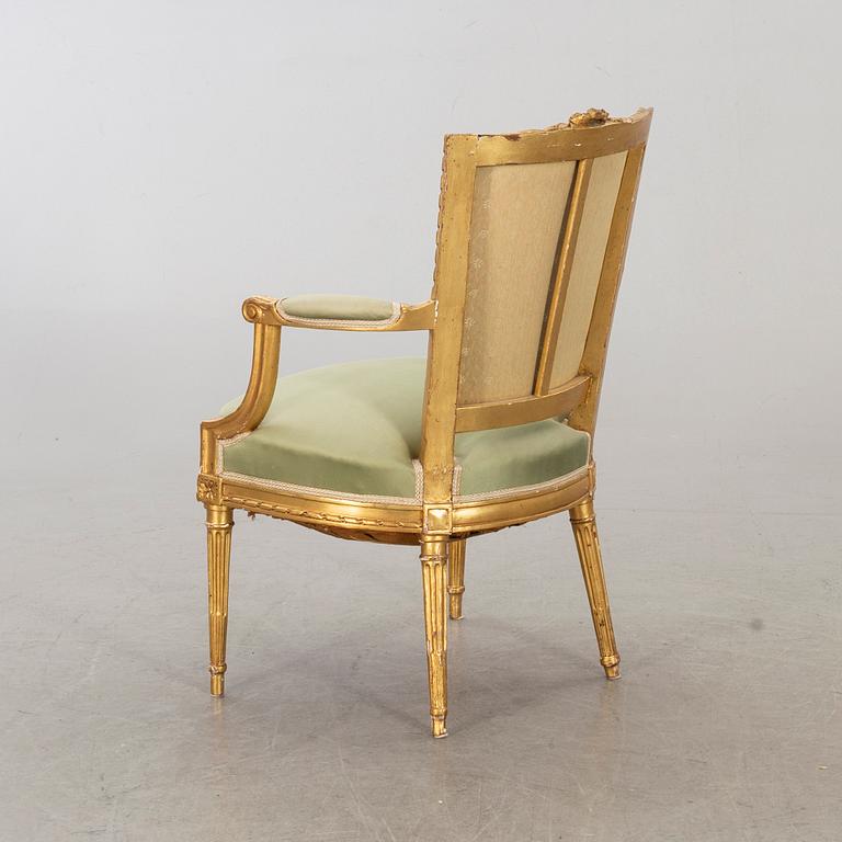 A Louis XVI-style arm chair, ca 1900.