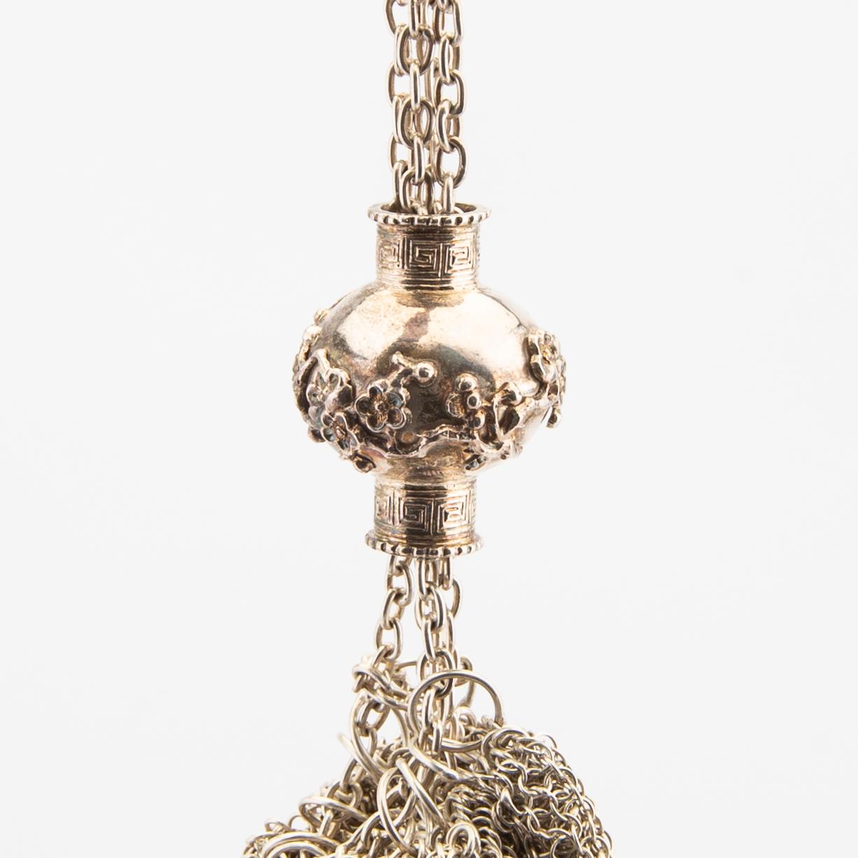 An Asian early 1900s silver bag, weight 396 grams.