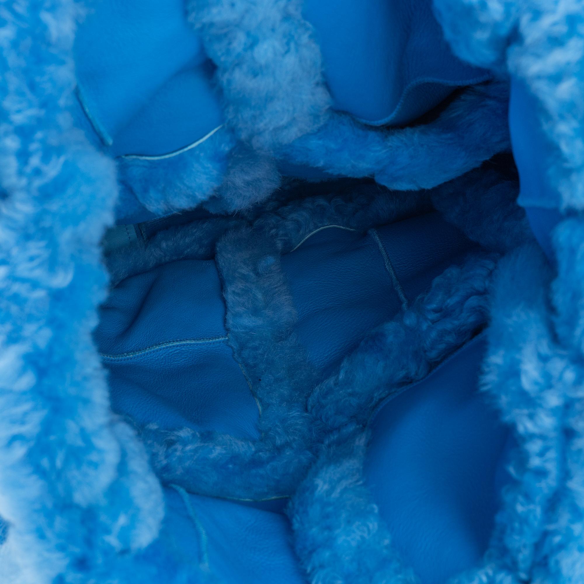 Bottega Veneta, A blue shearling intrecciato 'The Chain Tote'.