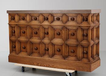 A sideboard attributed to Oscar Nilsson, oak and limestone sideboard, Stockholm 1940's.