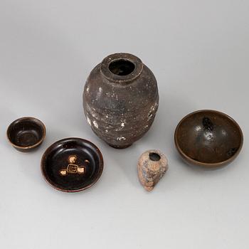 A group of five brown glazed South East Asian ceramics, 19/20th Century.