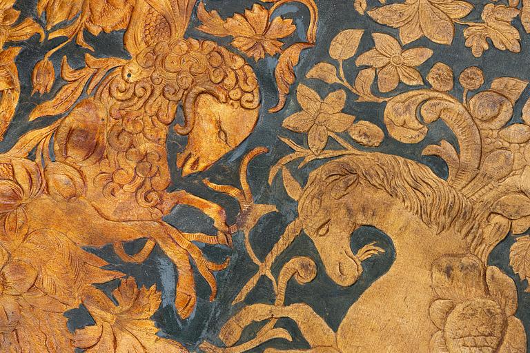 A 19th century wrought leather wallpaper, ca 388 x 97 cm.
