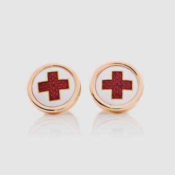 A pair of red and white enamel cufflinks.