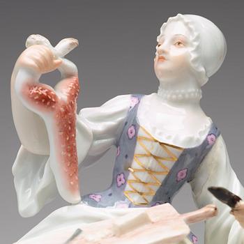 A Meissen figure of a woman preparing a rabbit, second half of 19th Century.