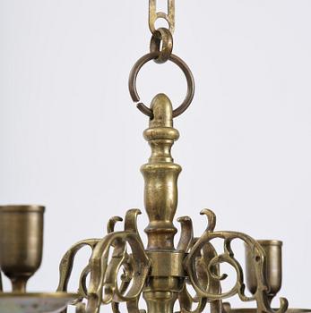 A four-branch baroque brass chandelier, late 17th century/circa 1700.