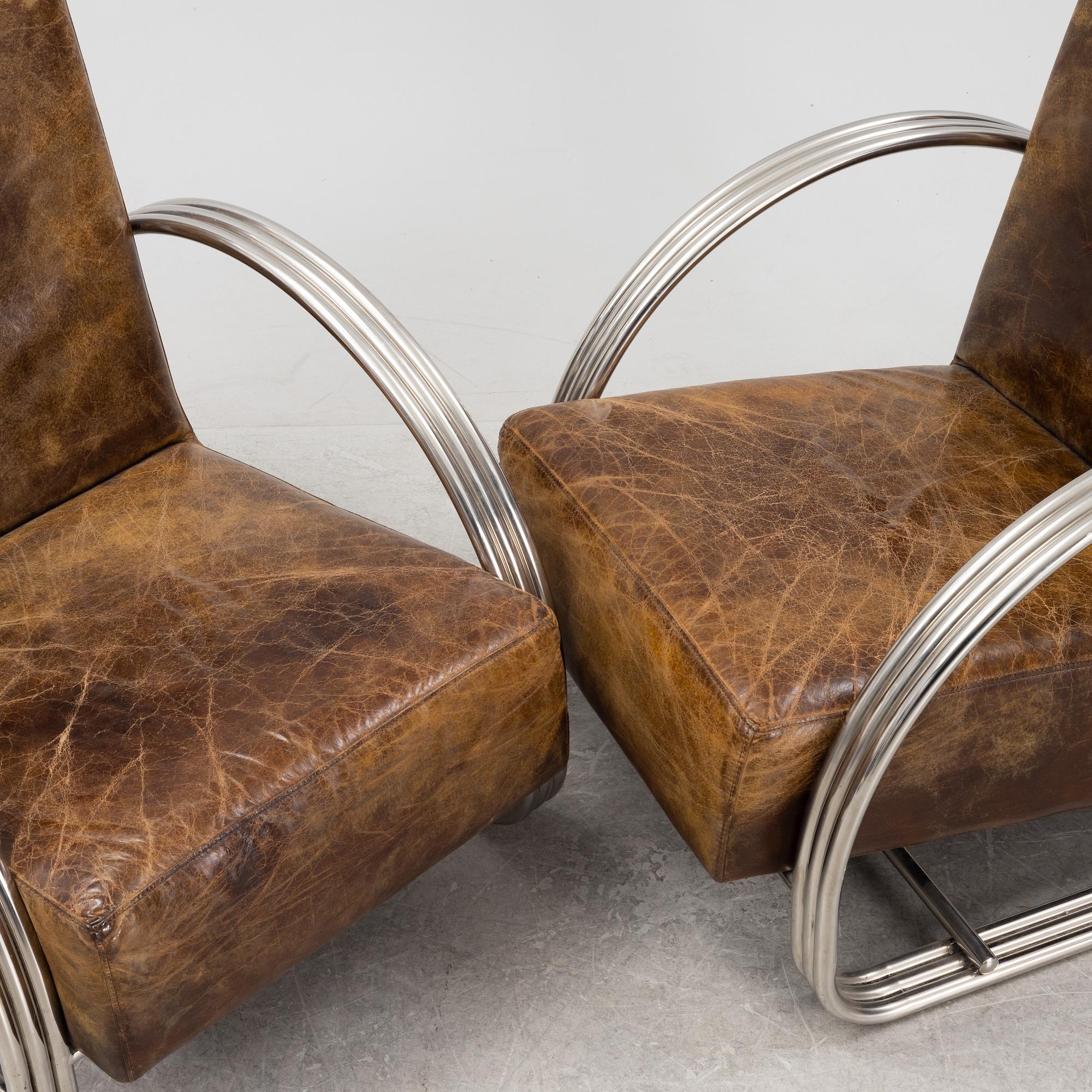 A pair of 'Hudson Street' lounge chairs from Ralph Lauren home.